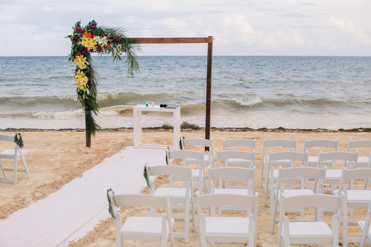 beach wedding ceremony palm tree decor