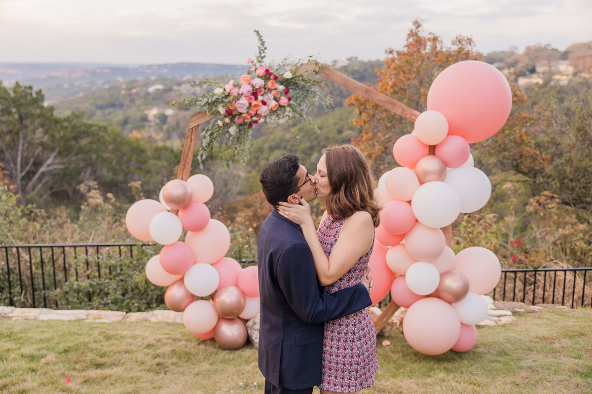 pink balloon, floral arrangement, wood hexagon ceremony arch