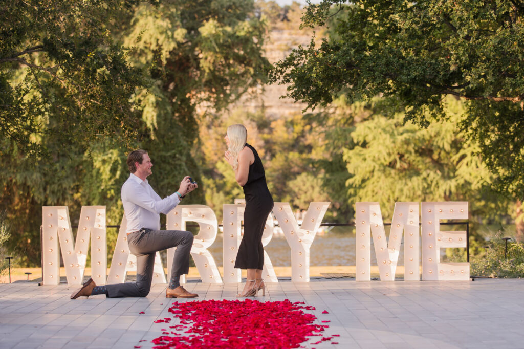 Romantic Proposal with Large Marry Me Sign