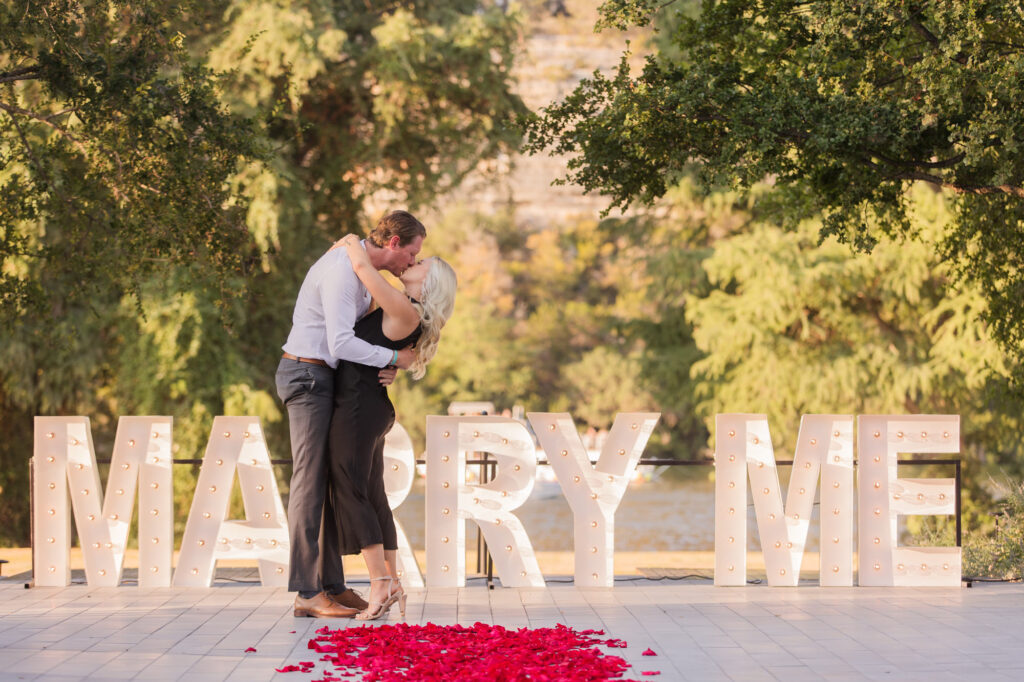 Romantic Proposal with Large Marry Me Sign