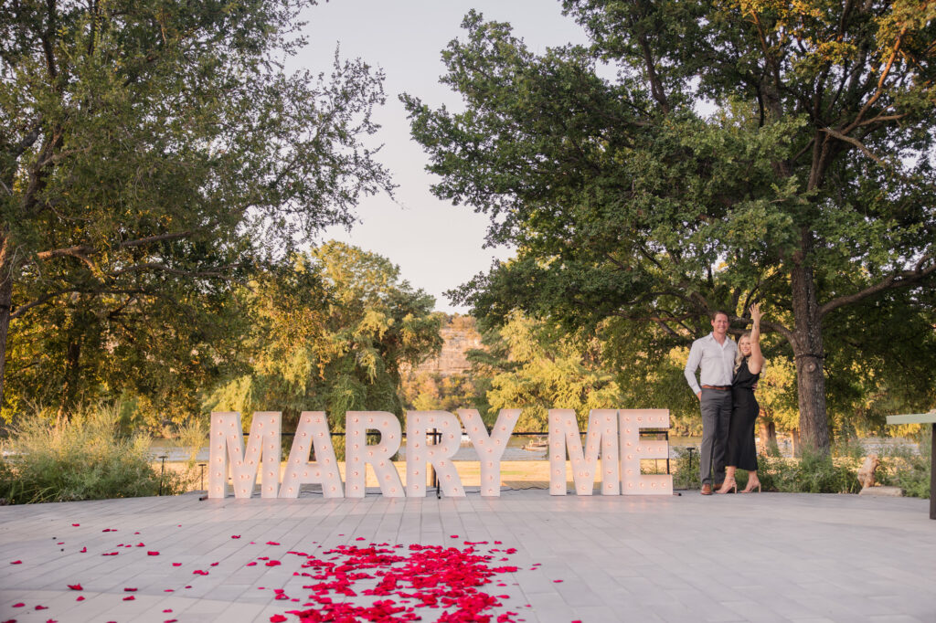 Romantic Proposal with Large Marry Me Sign