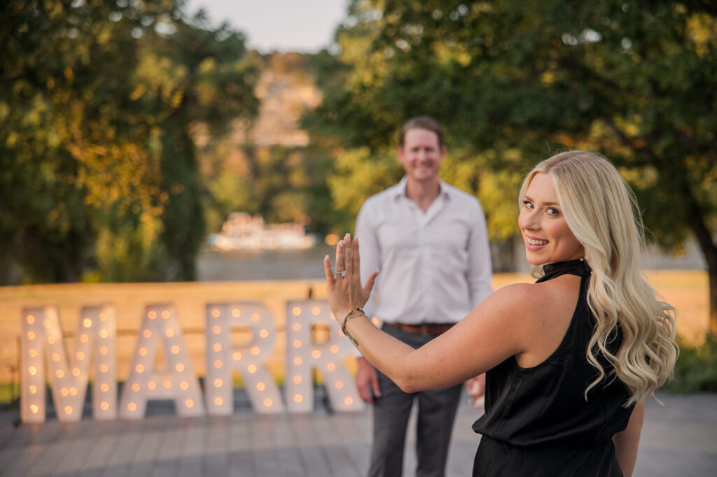 Romantic Proposal with Large Marry Me Sign