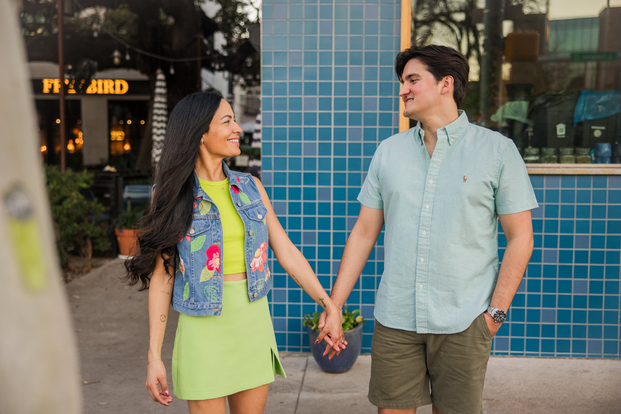 Colorful South Congress Engagement Photos | two hands coffee blue tile wall