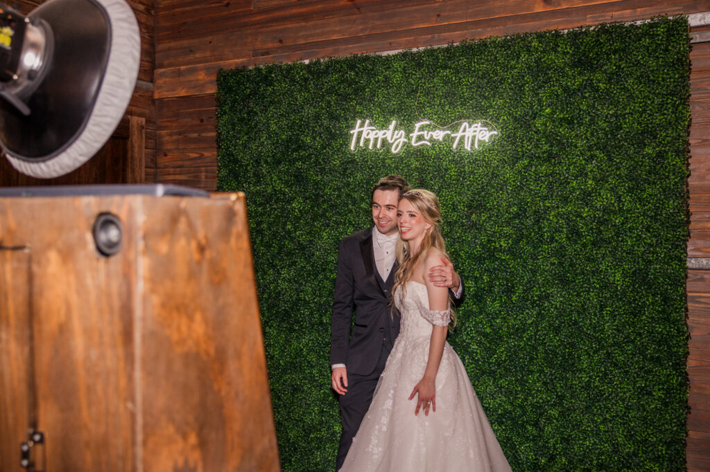 photo booth greenery wall wedding