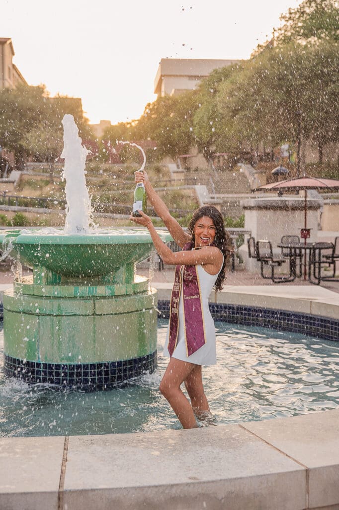Texas State Grad fountain champagne popping photo