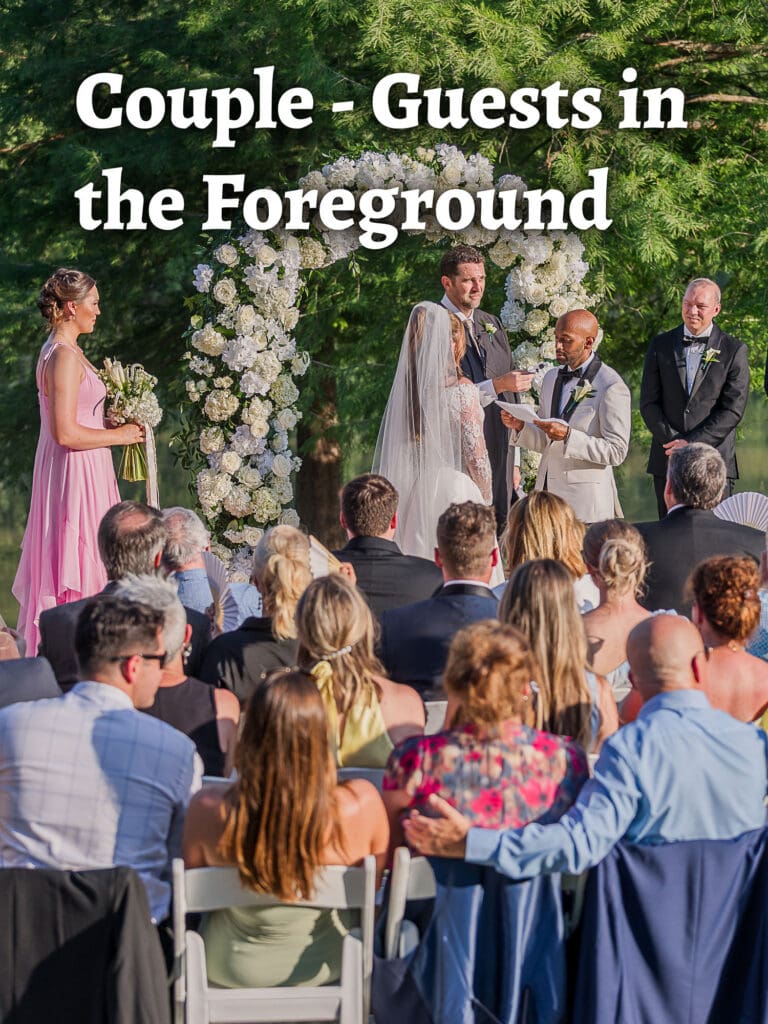 Wedding ceremony photo: couple with guests in the foreground